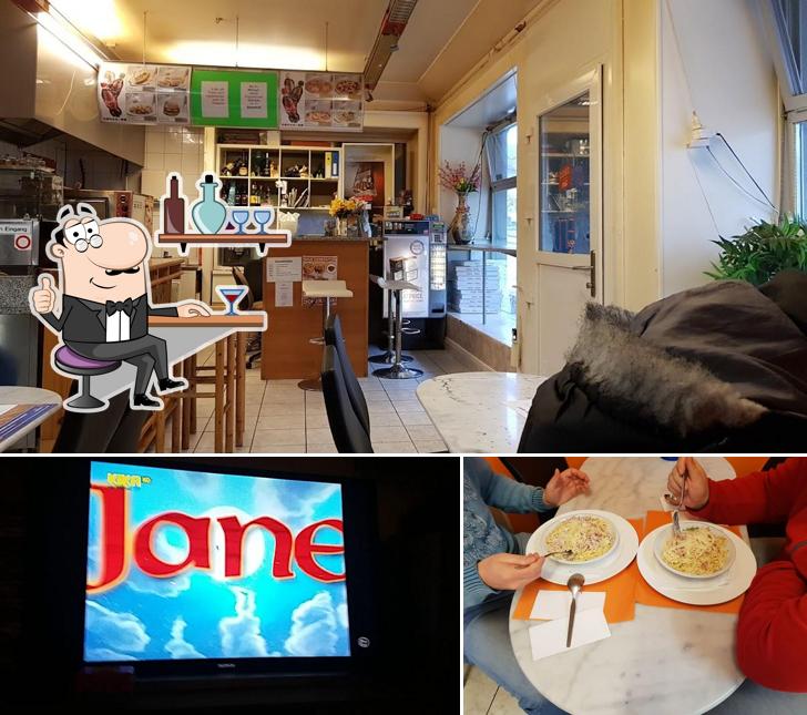 La immagine di interni e cibo da Bärenhof Pizzeria