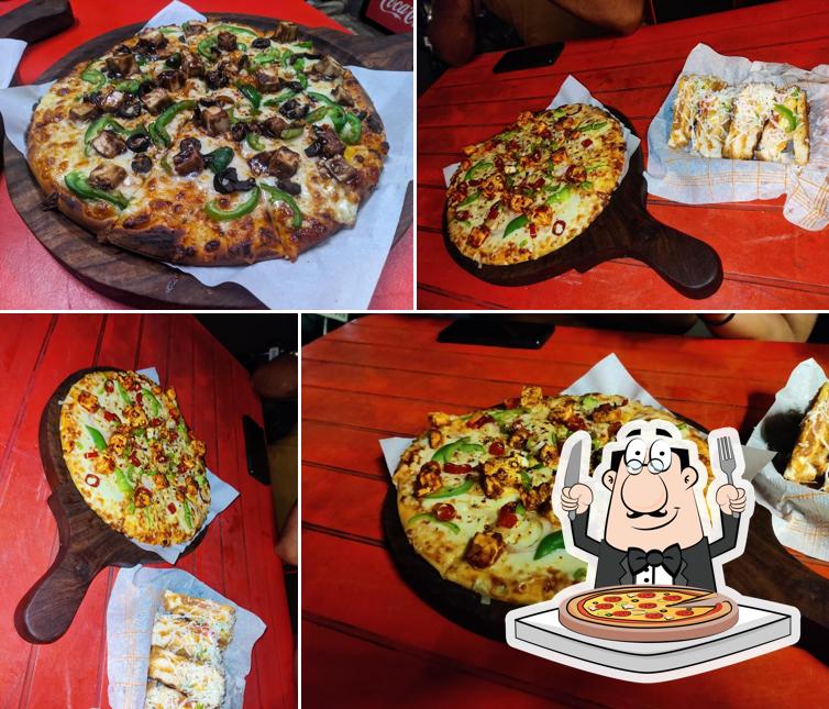 Get pizza at Amigos The Cafe