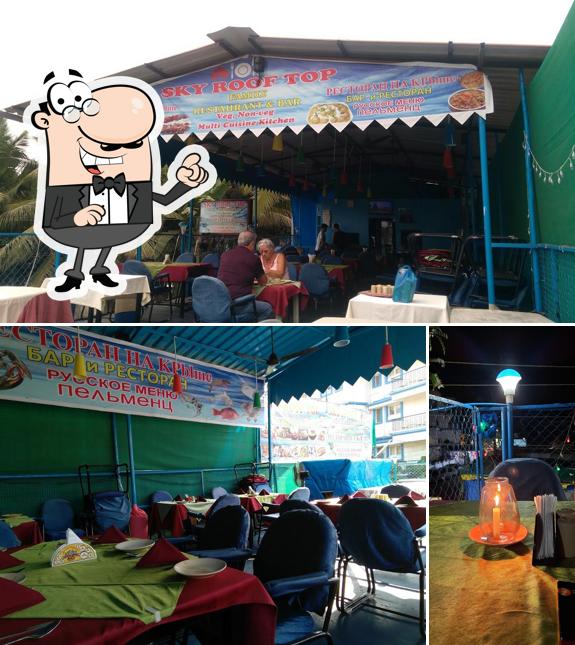 Take a seat at one of the tables at Sky Rooftop Restaurant