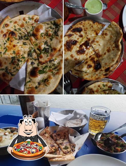 Get pizza at Vailankanni Beach Restaurant