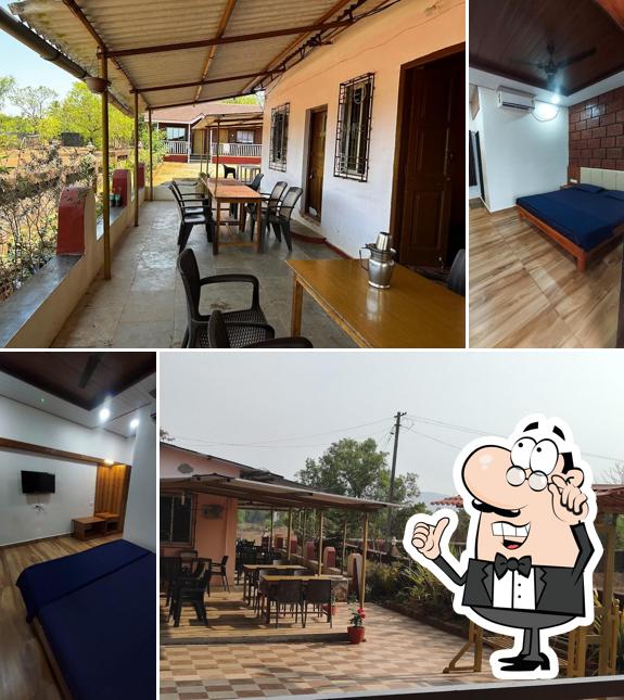 Take a seat at one of the tables at Hotel Omkar - The Best Holiday Home