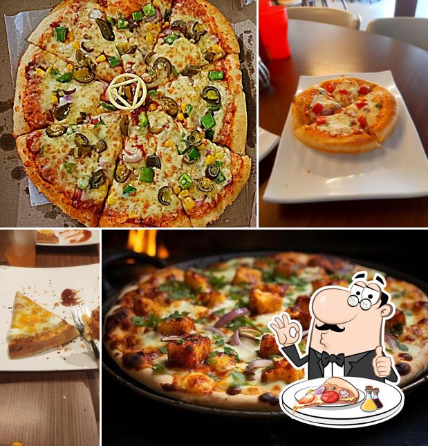 Try out pizza at Sam's Pizza Sanand Best family Restaurant in Sanand Best Fast food & Cafe Restro Best Pizza & Coffee Cafe in Sanand