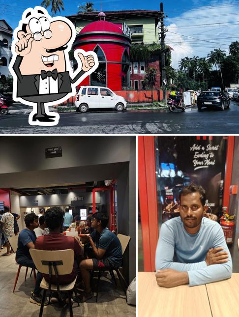 The photo of interior and exterior at KFC Candolim