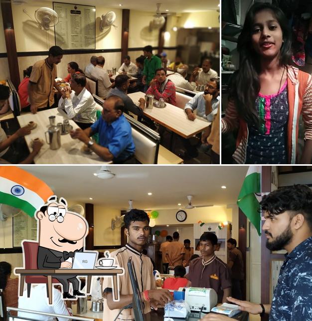 Take a seat at one of the tables at Cafe Sai Sadanand