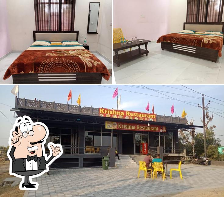 Take a seat at one of the tables at Krishna Hotel and restaurants