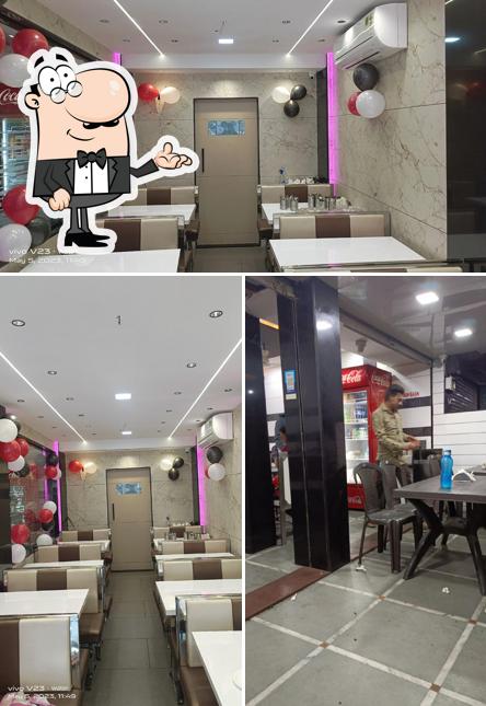 Take a seat at one of the tables at Hotel Maruti