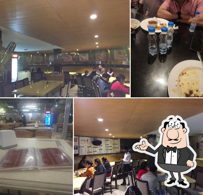 Take a seat at one of the tables at Hotel Red Mango