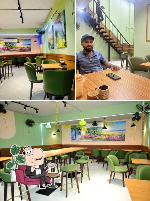 Take a seat at one of the tables at RTS CAFE CHARHOLI