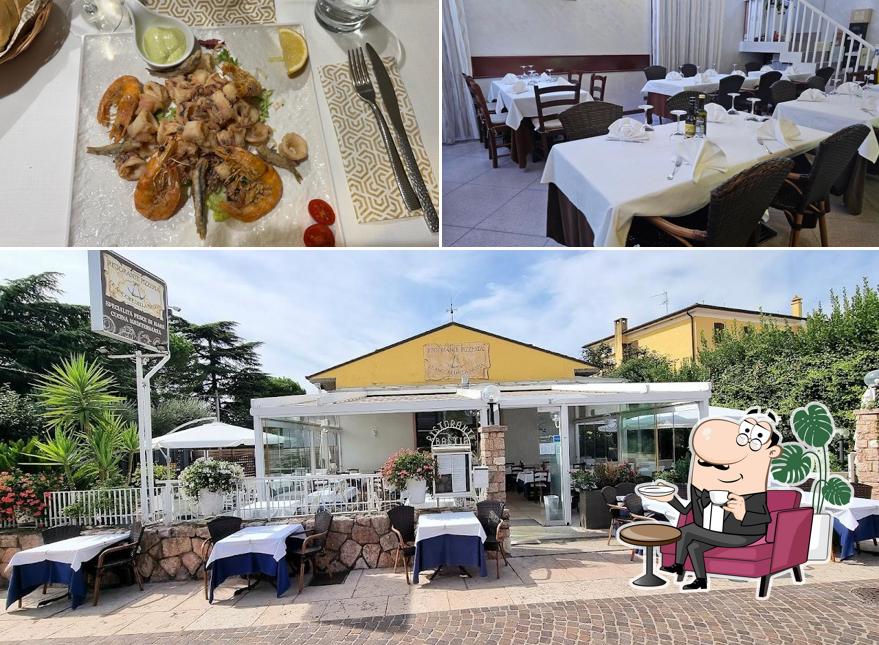 La immagine di interni e bevanda da Ristorante Pesce di Mare Le Ancore della Bastia