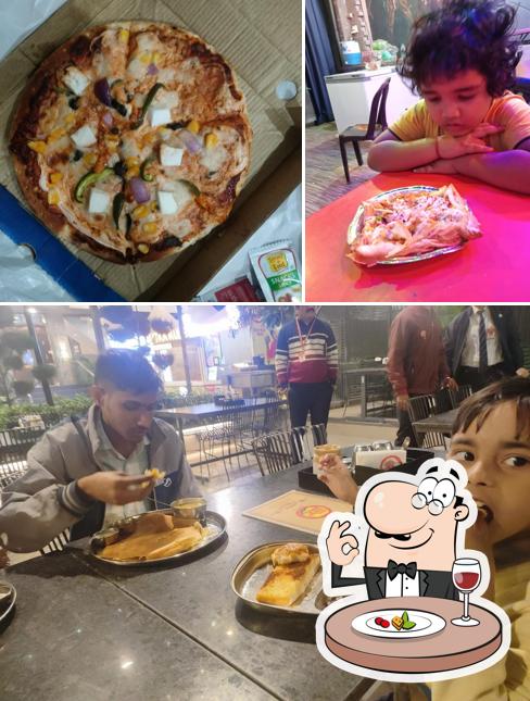 Check out the photo showing food and interior at UFO Restaurant