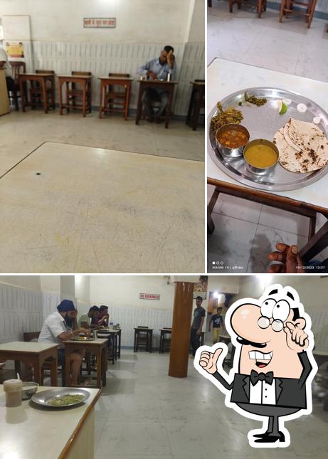 Take a seat at one of the tables at Jayshree Bhojanalay Pure Veg