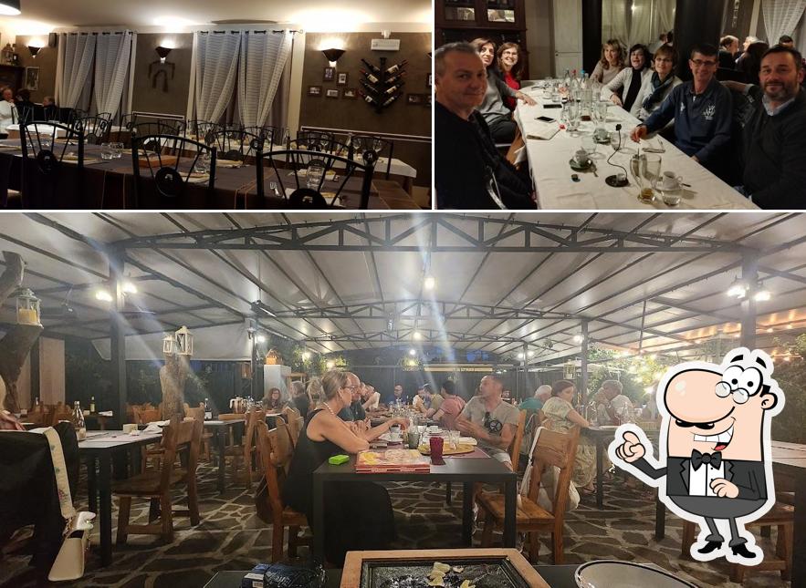 La immagine di interni e tavolo da pranzo da Trattoria Brea