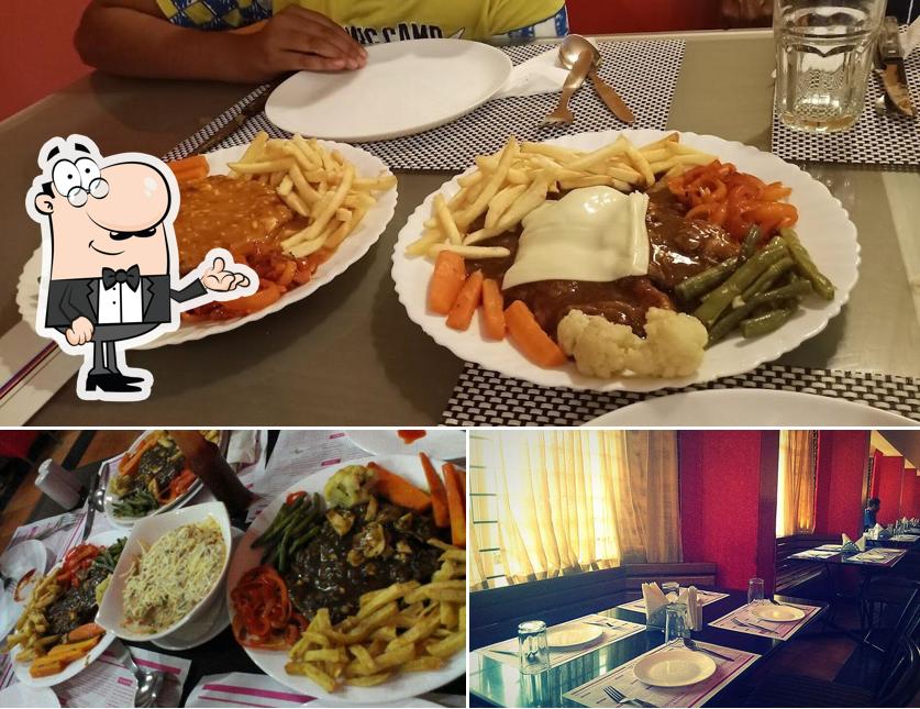 This is the picture depicting interior and food at Mezzaluna Indian & Continental Restaurant