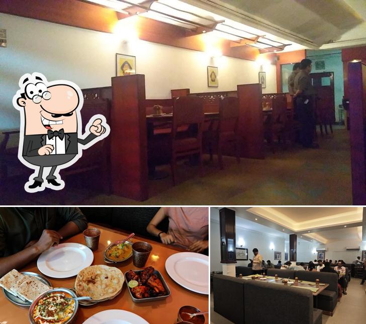 Take a seat at one of the tables at Tandoor Chillies Restaurant