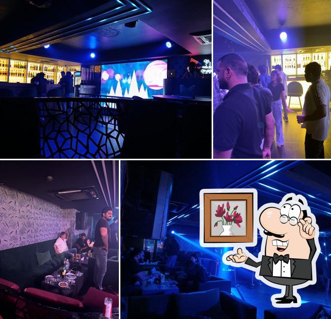 Take a seat at one of the tables at Qb Lounge