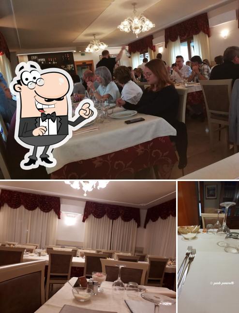 Siediti a un tavolo di Hotel Ristorante Adele