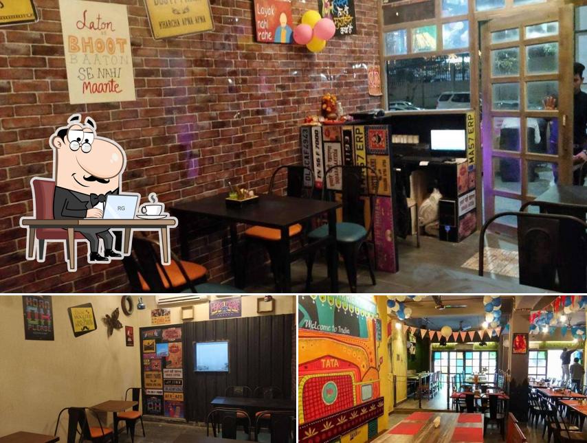 Take a seat at one of the tables at Dhaba -77