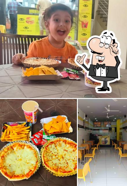 Check out the picture depicting interior and food at Burger bomb