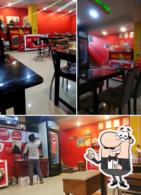 Take a seat at one of the tables at Yummy Land