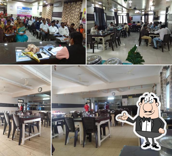 Take a seat at one of the tables at Hotel Samrudh
