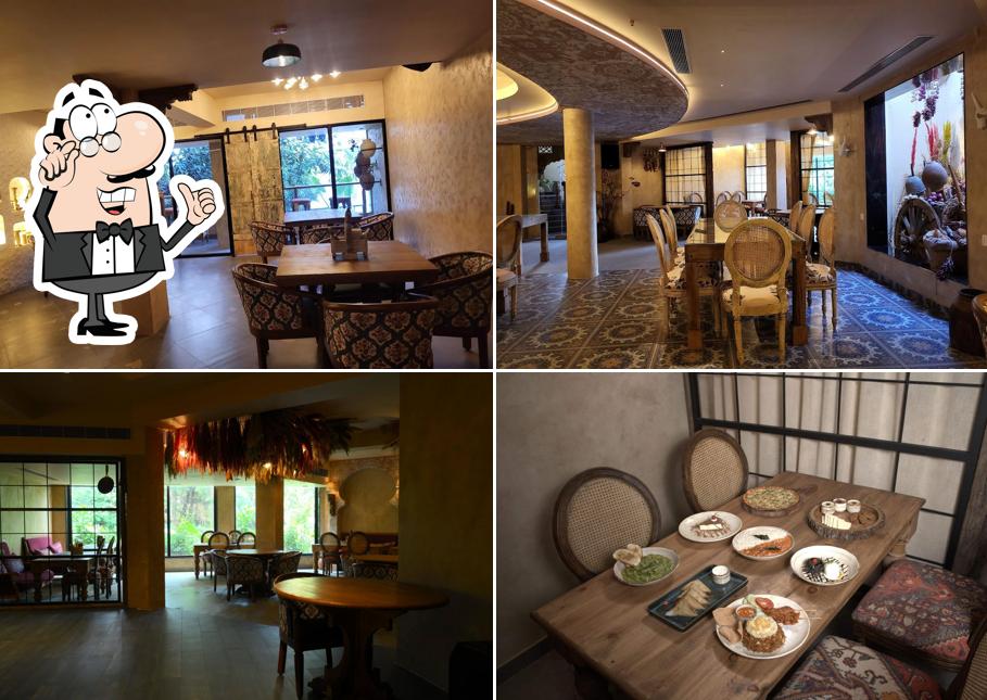 Take a seat at one of the tables at Aangan Restro Bar