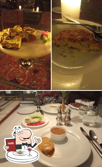 The photo of food and dining table at Pearls And Chiffon