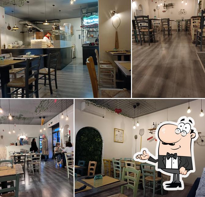 Dai un'occhiata agli interni di Mbriana Pizza & Food