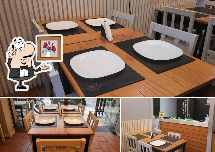 Sente em uma das mesas no Pizzaria Zero Zero