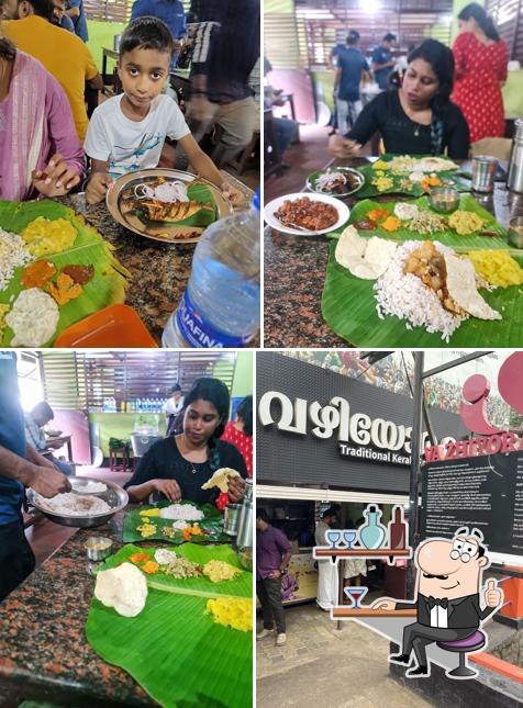 Take a seat at one of the tables at Vazhiyorakkada