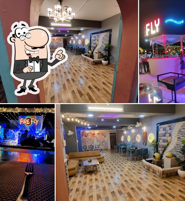Take a seat at one of the tables at Firefly Club & Restro