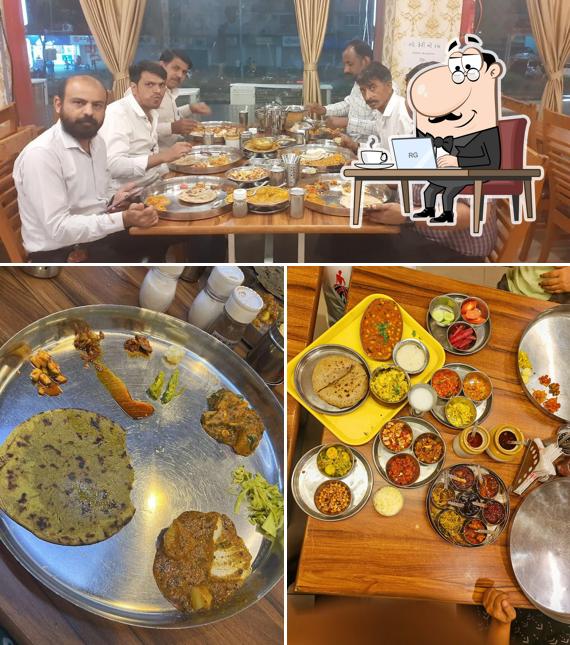 Take a seat at one of the tables at Shree Khodiyar Kathiyawadi Dhaba