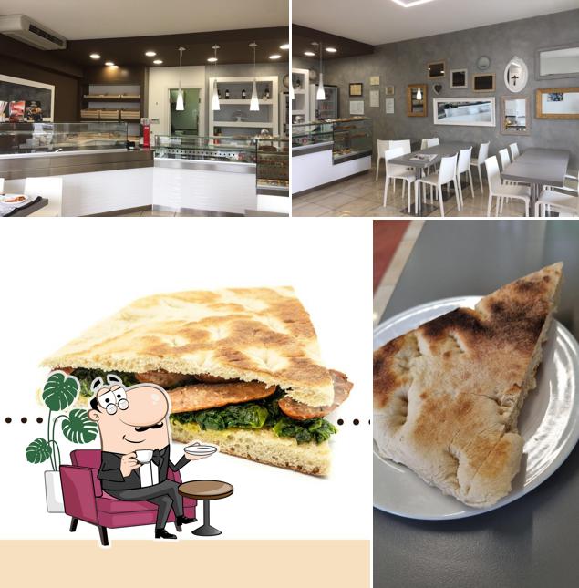Questa è la foto che mostra la interni e cibo di Il Panaro de la Fratta