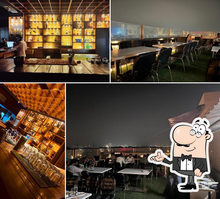 Take a seat at one of the tables at Xtasy Restobar – Best Bar & Pub in Velachery for Food, Drinks & Vibes