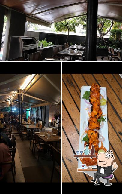 Take a seat at one of the tables at Nimantran Restaurant & Bar