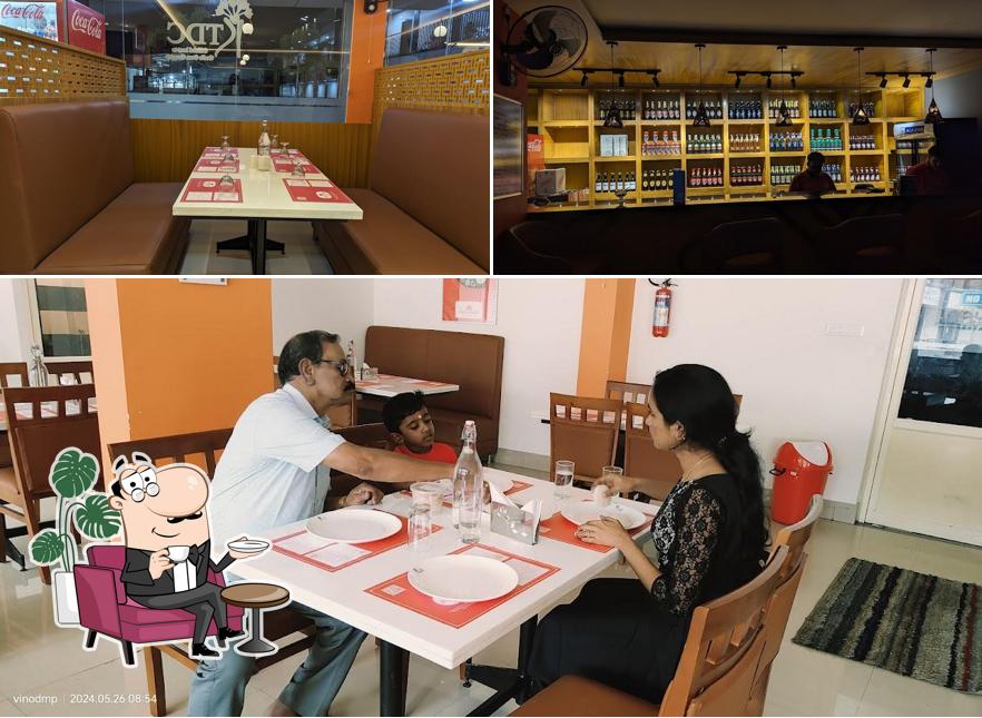 Take a seat at one of the tables at KTDC AAHAAR RESTAURANT MANNARKKAD