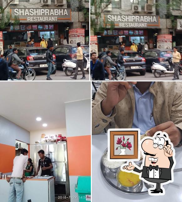 Take a seat at one of the tables at SHASHIPRABHA RESTAURANT