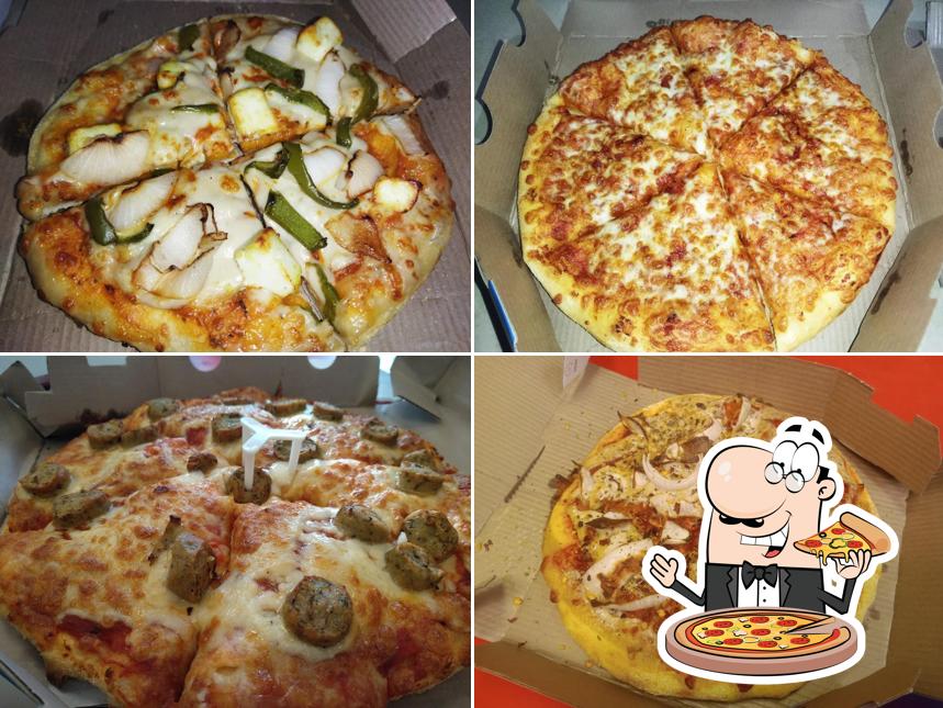 Pick pizza at Domino's Pizza 4D Square Mall, Ahmedabad