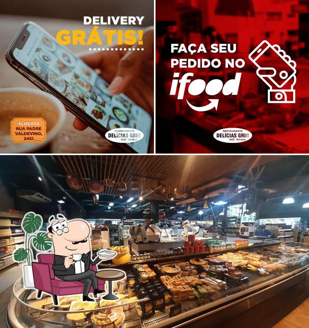 O interior do Restaurante Delícias Grill