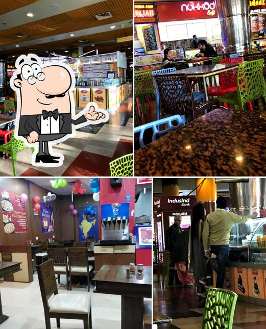 Take a seat at one of the tables at Spice Cinemas Food Court