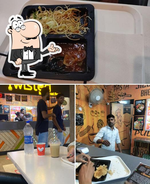 Check out the photo showing interior and food at Twisted indian street food