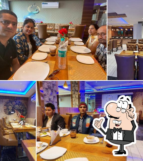 Take a seat at one of the tables at Namaste Restaurant - Opp. Prem Mandir, Vrindavan