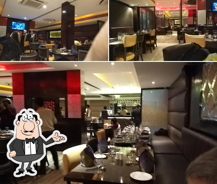 Take a seat at one of the tables at Pinch Of Spice