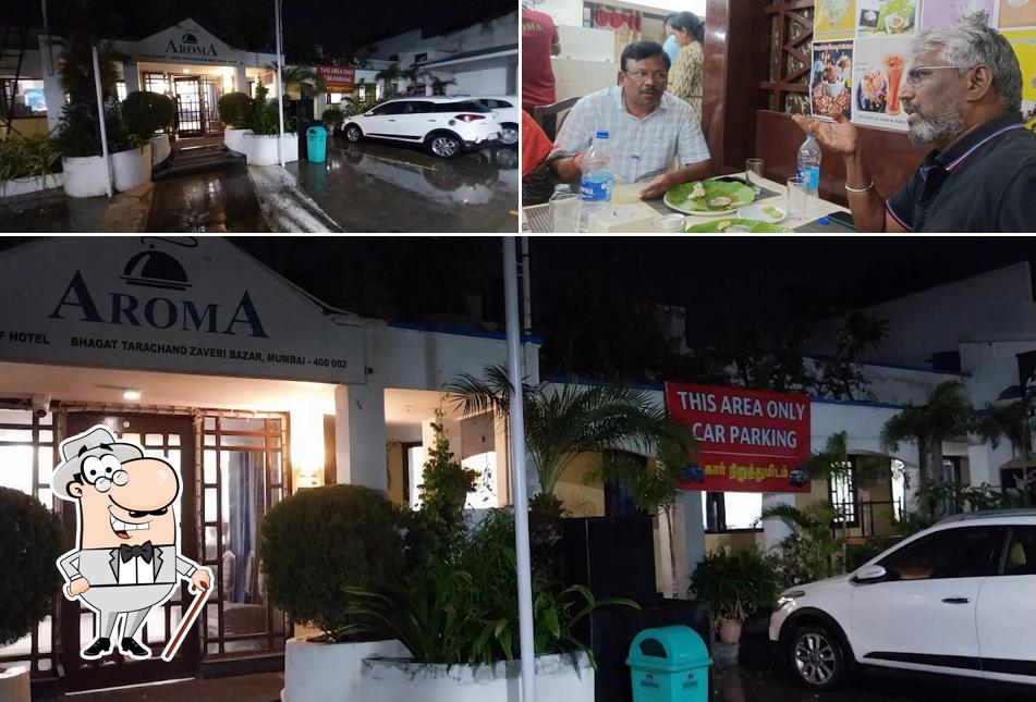 The photo of exterior and beverage at Aroma Restaurant