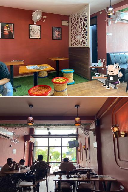 Take a seat at one of the tables at CHAI SUTTA BAR
