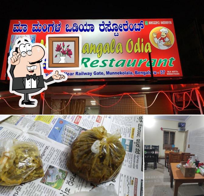 Take a seat at one of the tables at Maa Mangala Odia Restaurant