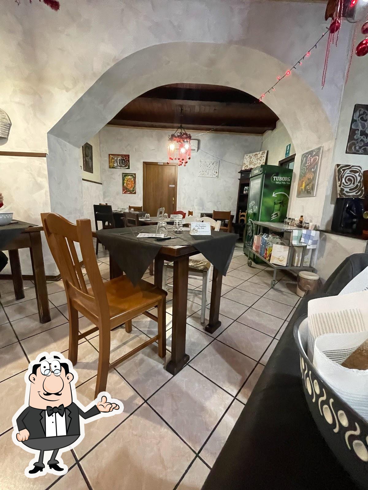 Siediti a un tavolo di La Cantina. Siediti a un tavolo di La Cantina.