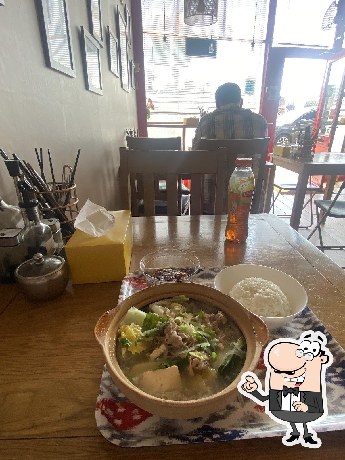 Take a seat at one of the tables at Beijing Cooking Pot.