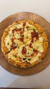 Santa Maradó Pizza Porteña