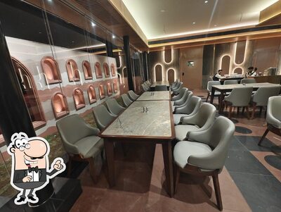 Take a seat at one of the tables at Hotel Chandan Inn