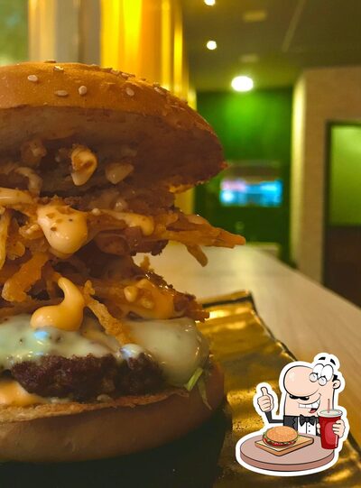 Order a burger at Baba Shams Cafe